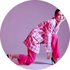 portrait-young-woman-standing-against-wall (1)